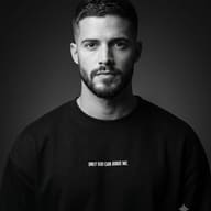AI generated studio portrait of a bearded man wearing a black sweatshirt with "ONLY GOD CAN JUDGE ME." text.