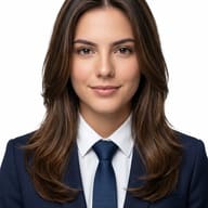 Gemini AI Generated Professional executive headshot of a young woman with layered brown hair wearing a navy suit and textured tie against a solid white background.