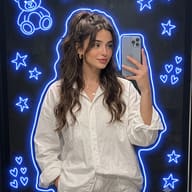 Gemini AI Generated Medium-shot mirror reflection selfie of a girl with a messy half-up ponytail, featuring a digital blue neon glowing outline and clusters of small neon heart doodles.