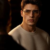 man-cream-sweater-round-glasses-chiaroscuro-lighting-portrait-ai-prompt-by-promptplum-6