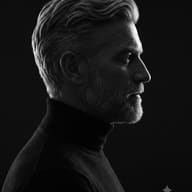 Old Men Black & White Dramatic Profile Portrait AI Photo Editing Prompt. AI generated high-quality studio portrait of a man in profile wearing a black turtleneck, featuring stark chiaroscuro lighting on his face.