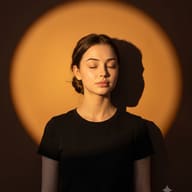AI generated portrait of a young woman with a hair bun, eyes closed, standing calmly inside a warm orange circular light projection.