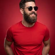 Man in Round Sunglasses and Red T-shirt Studio Portrait
AI Photo Editing Prompt AI generated studio portrait of a smiling young man wearing round sunglasses and a red t-shirt looking away against a monochromatic red background.