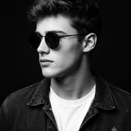 Man in Round Sunglasses AI Photo Editing Prompt. AI generated studio portrait of a young man with wavy hair, wearing a denim jacket and round sunglasses, looking in profile against a dark background.