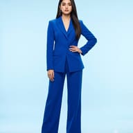 Indian Woman in blue pantsuit studio portrait AI Photo Editing Prompt. AI generated fashion portrait of a confident young woman wearing a vibrant tailored blue suit against a light blue background.
