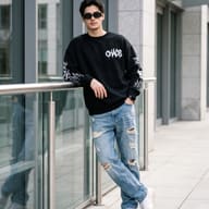 Urban Streetwear Fashion Portrait AI Photo Editing Prompt. AI generated outdoor portrait of a stylish young man wearing a black "CHAOS" sweatshirt, ripped jeans, and sunglasses leaning against a glass railing in a modern city setting.