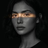 Golden Light Streak Portrait of Woman AI Photo Editing Prompt. AI generated dramatic portrait of a young woman with a sharp, horizontal band of golden light across her eyes against a dark, low-key background.