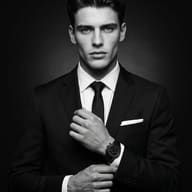 Cinematic Monochrome Portrait AI Photo Editing Prompt. AI generated fashion portrait of a man in a black suit adjusting his cuff.