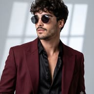 AI generated studio portrait of a curly-haired man wearing a burgundy blazer, black shirt, and round sunglasses.