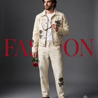 Man in Floral Denim Editorial Portrait AI Photo Editing Prompt. AI generated fashion magazine cover of a young man in off-white denim with black roses, holding a red rose.