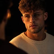man-cream-sweater-round-glasses-chiaroscuro-lighting-portrait-ai-prompt-by-promptplum-5