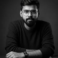 Black and White Studio Portrait of Man with Glasses AI Photo Editing Prompt.