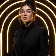 AI Prompt For Woman: High-end fashion portrait of a woman with dark hair in a top knot, wearing clear glasses and a black blazer, illuminated by warm neon ring lighting.