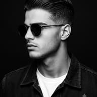 Man in Round Sunglasses AI Photo Editing Prompt. AI generated studio portrait of a young man with wavy hair, wearing a denim jacket and round sunglasses, looking in profile against a dark background.