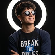 Neon Ring Light DP Portrait AI Photo Editing Prompt. AI generated portrait of a smiling man in round sunglasses and "Break The Rules" sweatshirt against neon ring light.