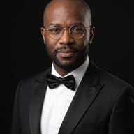 AI Generated Elegant portrait of a confident man in a black tuxedo, bow tie, and round glasses against a dark background.