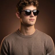 warm-tone-studio-man-sunglasses-portrait-ai-prompt-by-promptplum-2