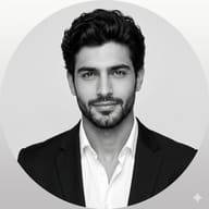 AI generated professional monochrome portrait of a man with dark hair and a beard, in a suit, presented within a circular frame.